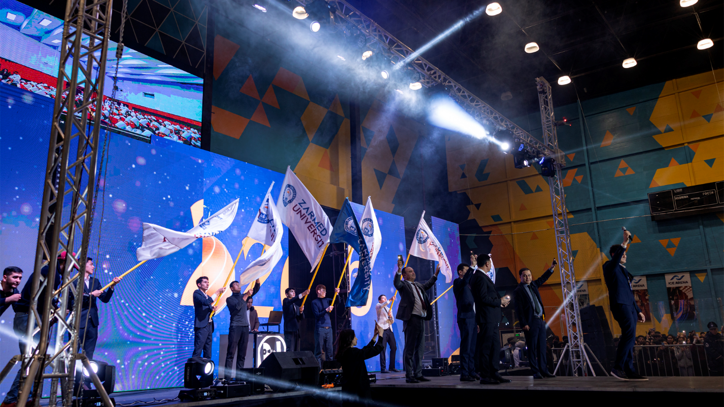 ZARMED University flag ceremony on stage